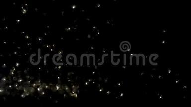 黑色背景下的金色浮动粒子，假日、圣诞节或新年的抽象粒子